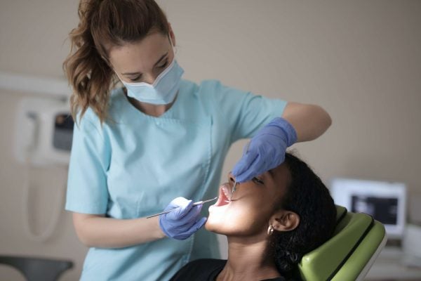 Dentist extracting teeth